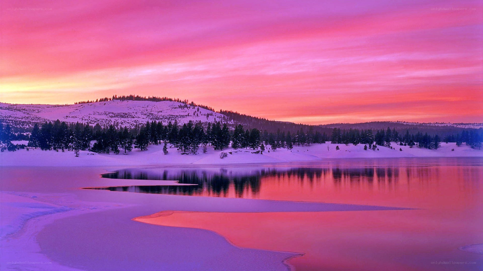 Vibrant sunset over snowy lake