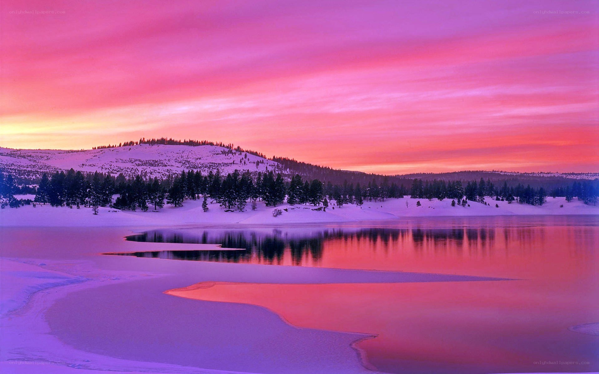 Vibrant sunset over snowy lake
