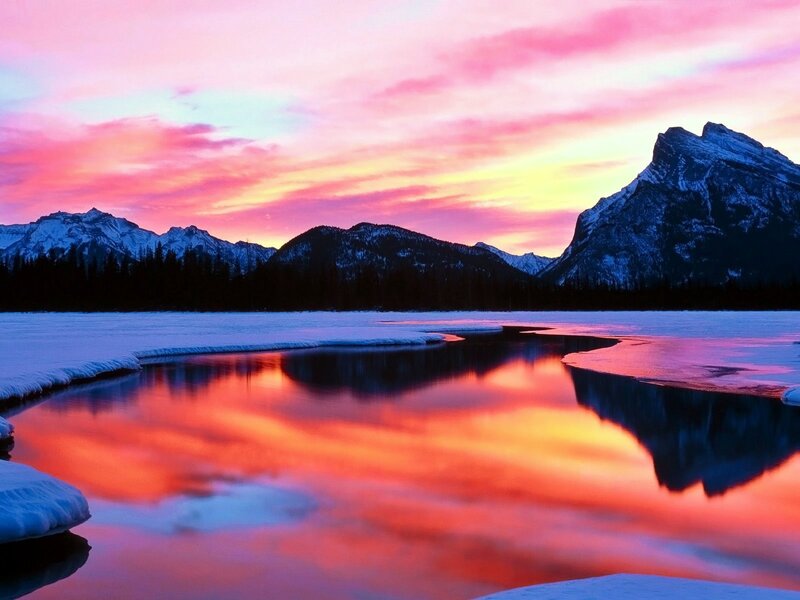 Vibrant sunset over snowy mountains