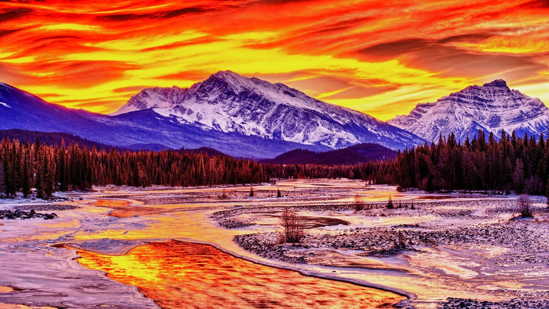 Vibrant sunset over snowy mountains