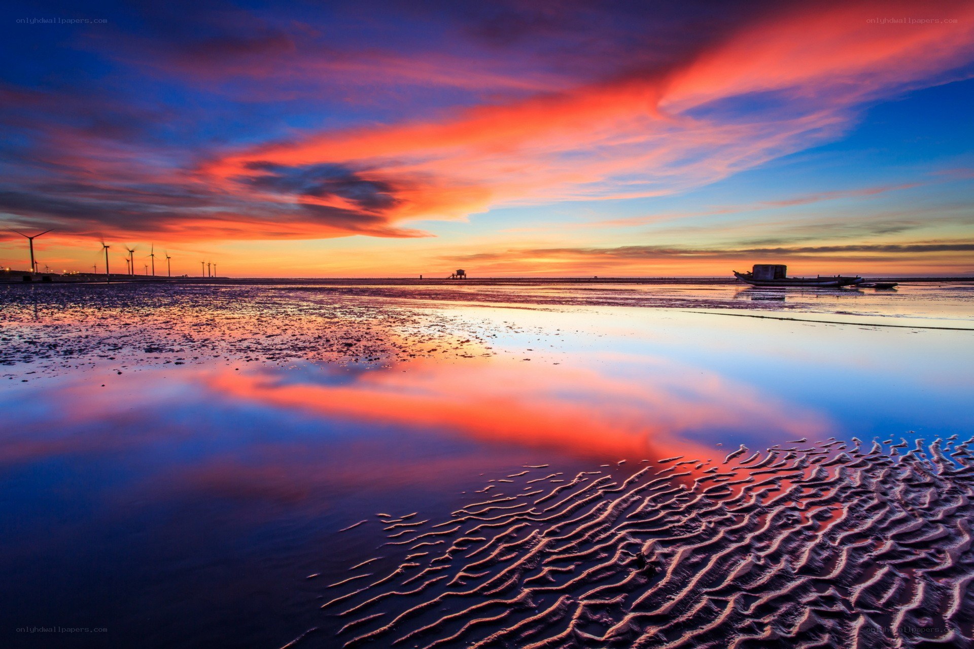 Vibrant sunset over tidal flats
