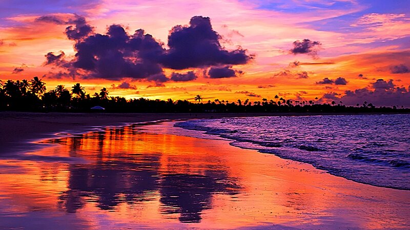 Vibrant sunset over tropical beach