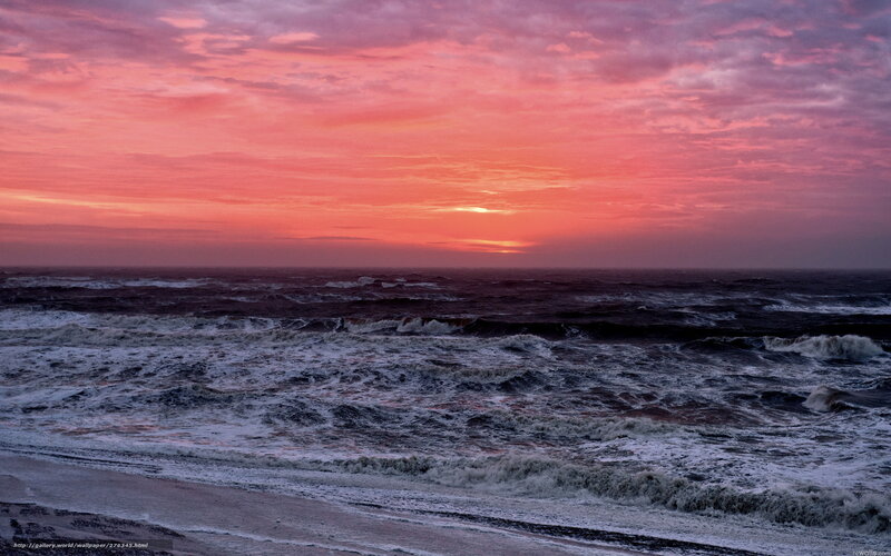 Vibrant sunset over turbulent sea