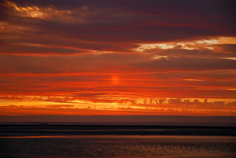 Vibrant sunset over water