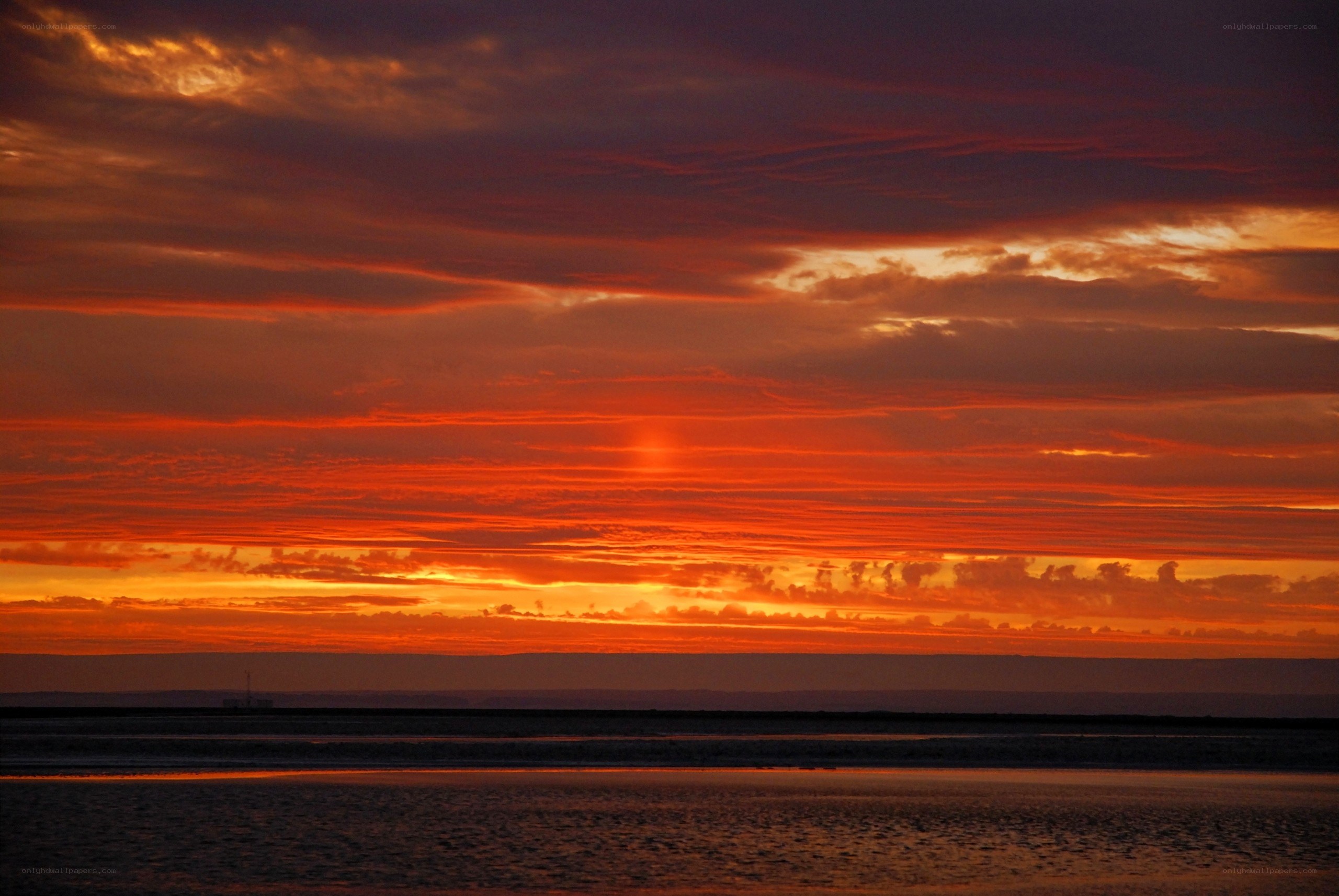 Vibrant sunset over water