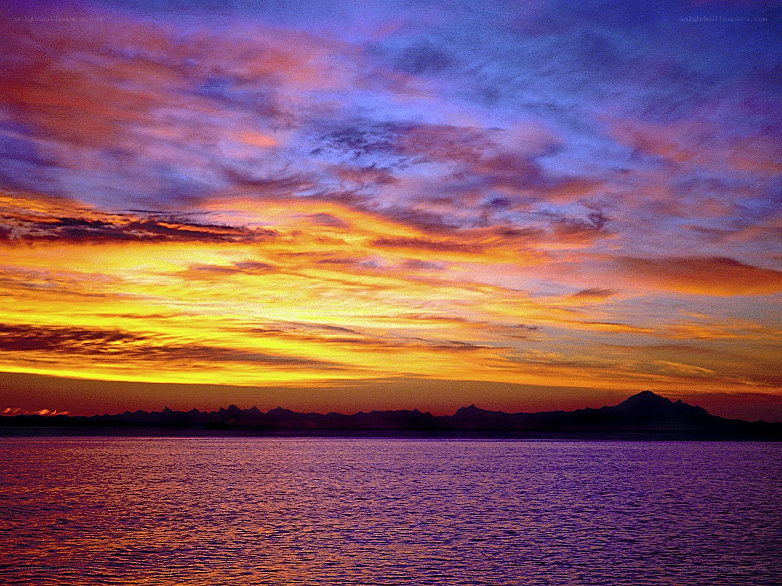 Vibrant sunset over water