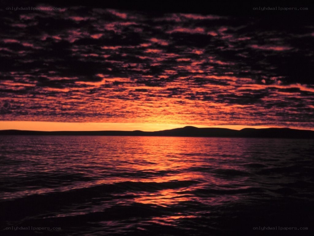 Vibrant sunset over water