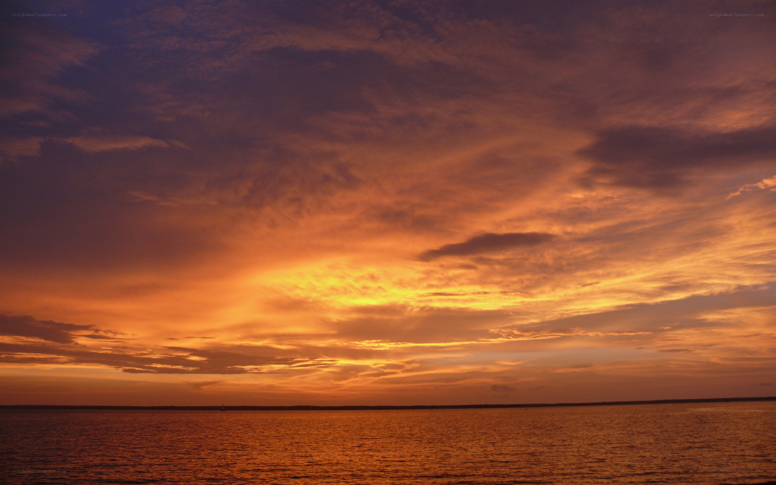 Vibrant sunset over water