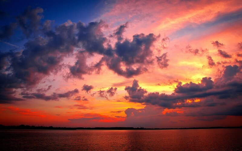Vibrant sunset over water