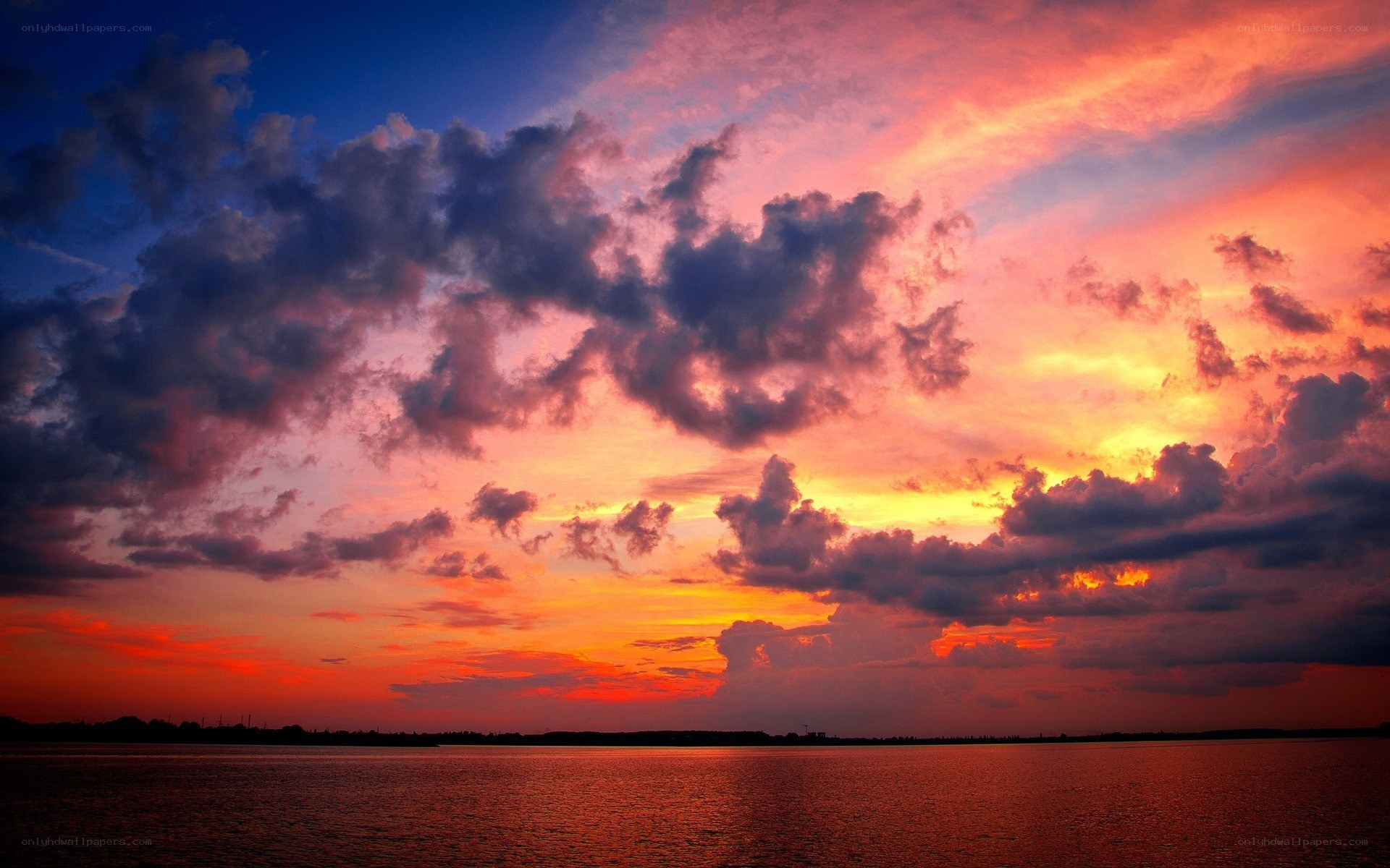 Vibrant sunset over water