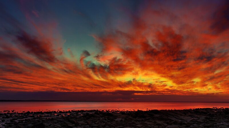 Vibrant Sunset over Water — Red