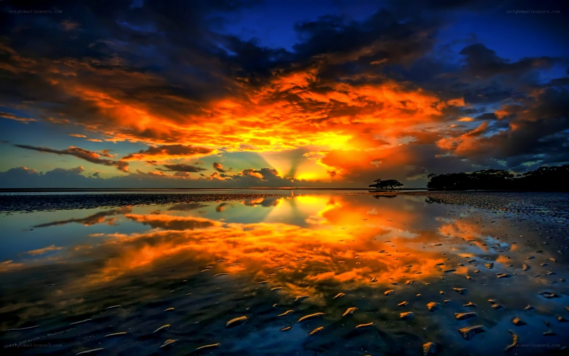 Vibrant sunset over wet sand