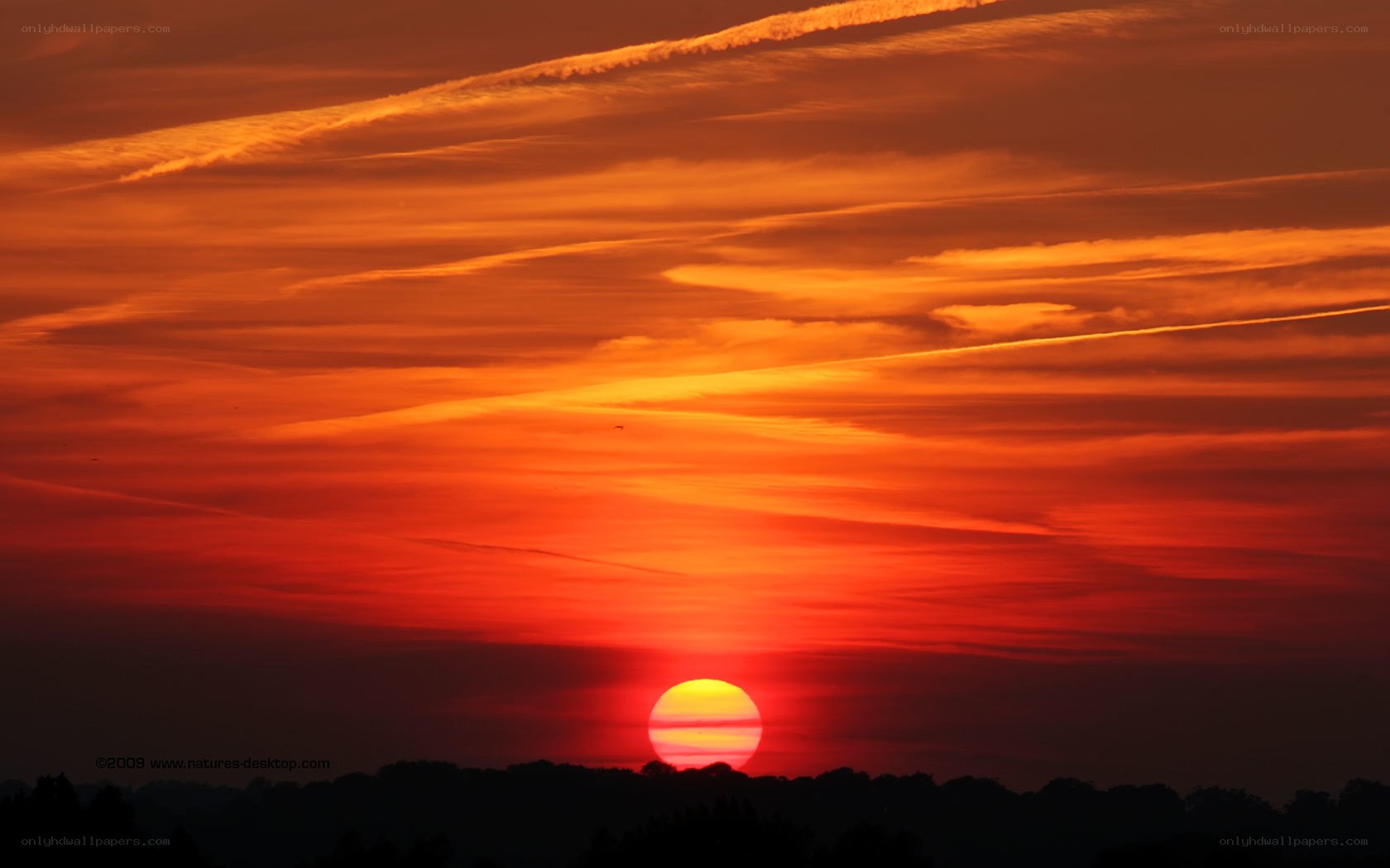 vibrant sunset with contrails