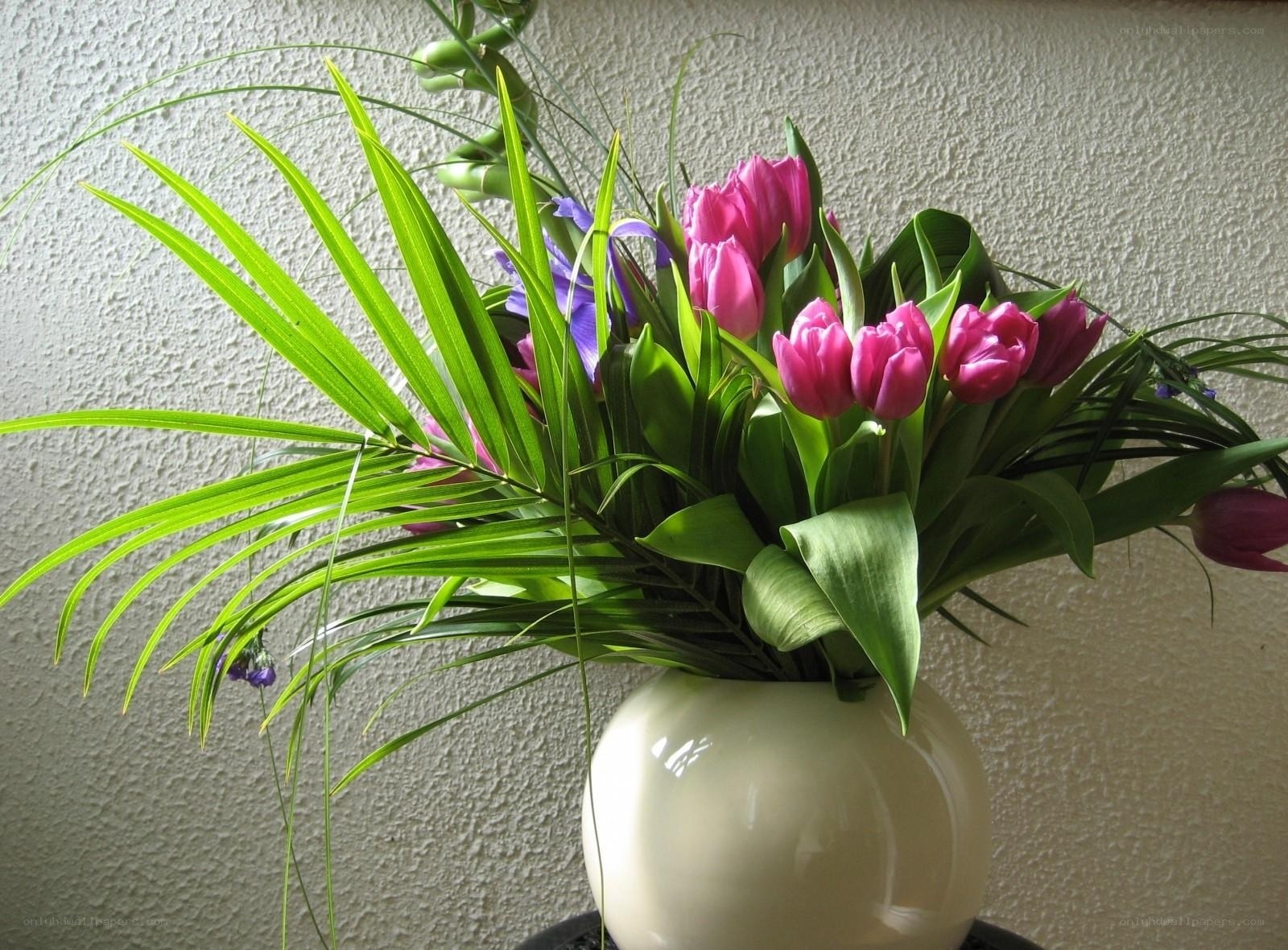 Vibrant tulip and palm arrangement