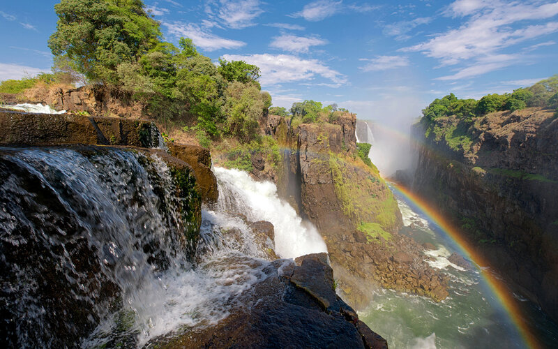 Victoria Falls Waterfall — Blue, Dramatic, Afternoon, Photograph, Rainbow, Cliffs