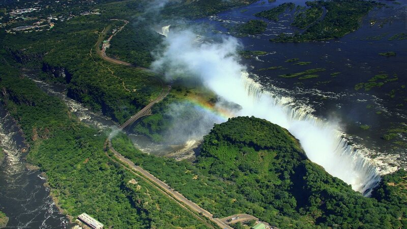 Victoria Falls Waterfall — Green, Dramatic, Afternoon, Photograph, Rainbow, Bridge, River, Forest, White