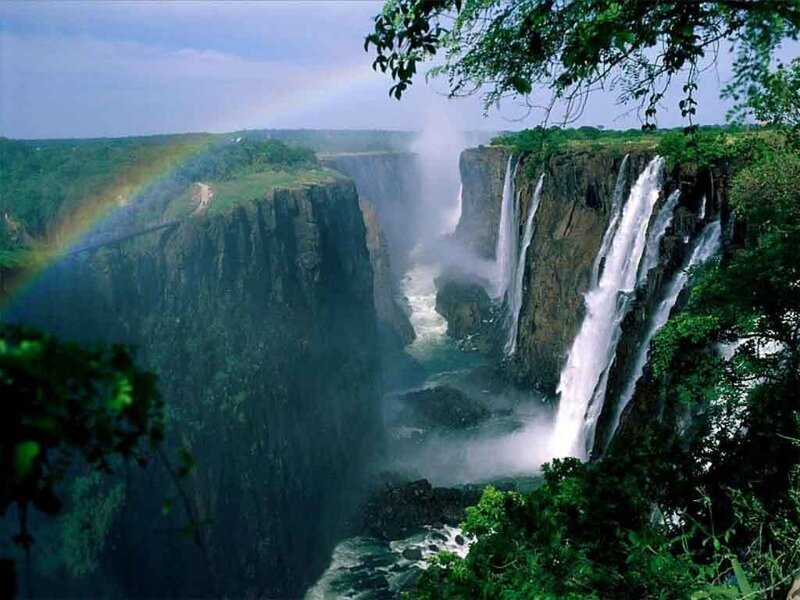 Victoria Falls Waterfall — Green, Dramatic, Afternoon, Photograph, Rainbow, Cliff, River, Trees, Blue, White