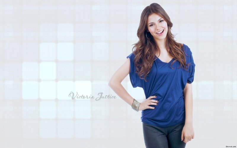 Victoria Justice smiling in blue top