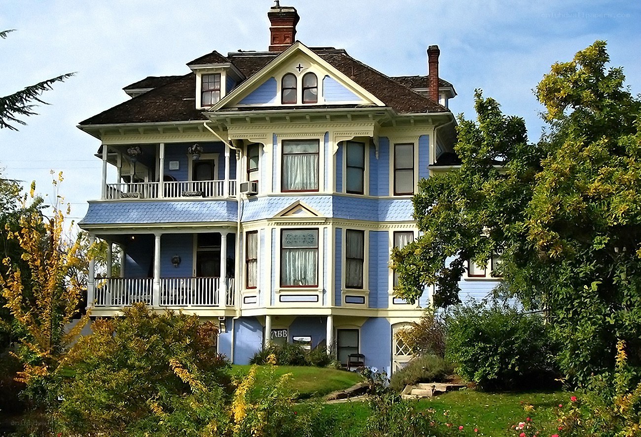 Victorian house with blue siding