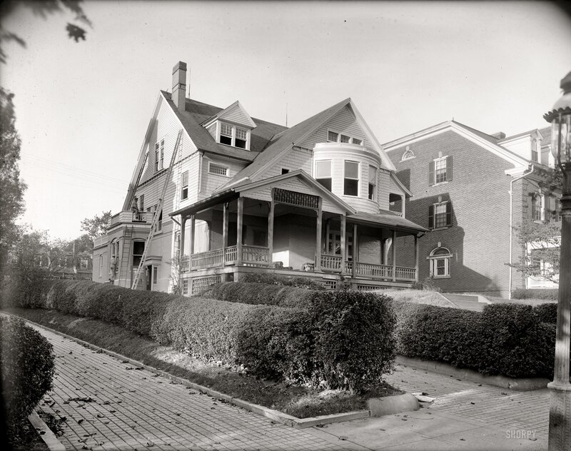 Victorian house with porch and ladder