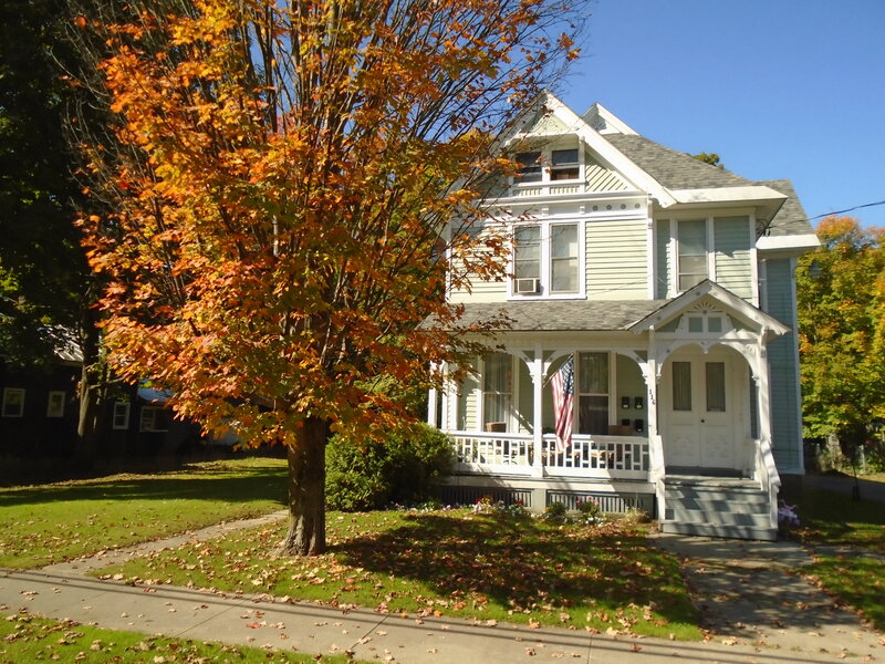Victorian House with Porch — Green, Serene, Autumn