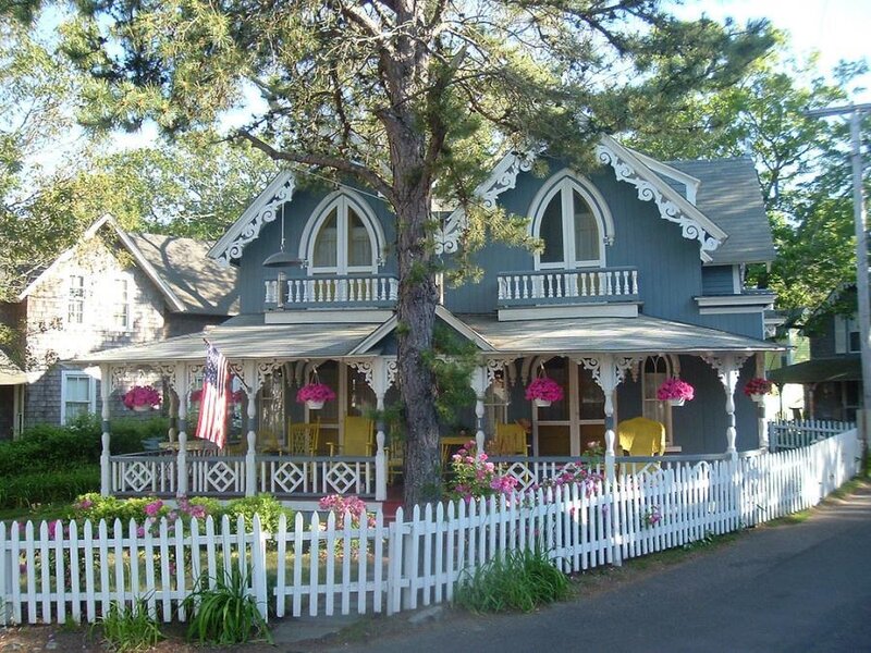 Victorian house with white picket fence