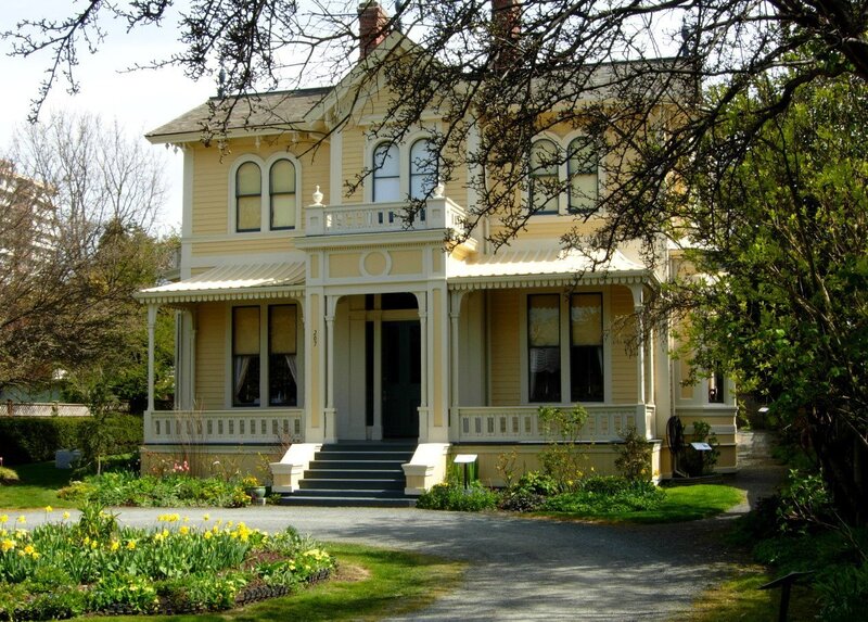 Victorian house with yellow flowers