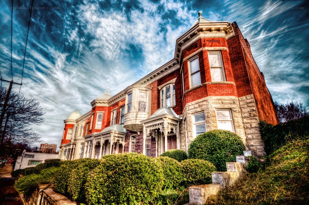 Victorian houses under dramatic sky