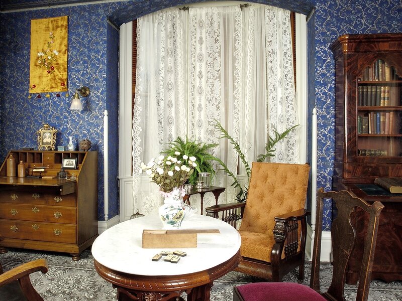Victorian parlor with blue wallpaper