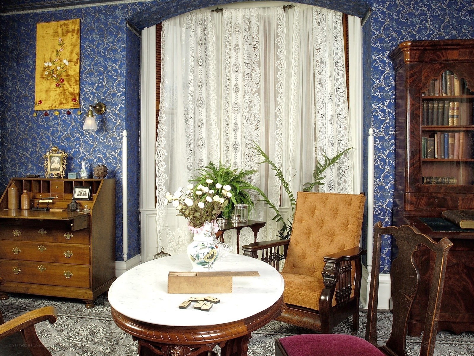 Victorian parlor with blue wallpaper