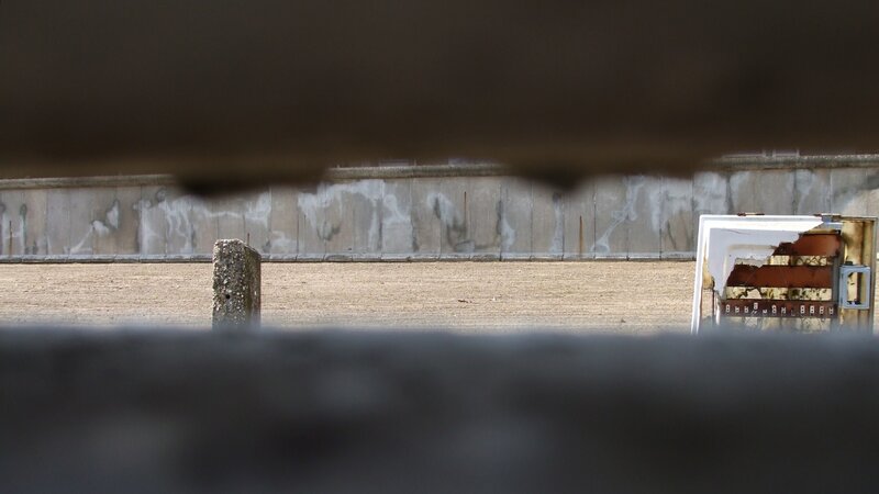 View through a gap at an empty lot