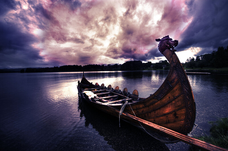 Viking boat on a lake at sunset