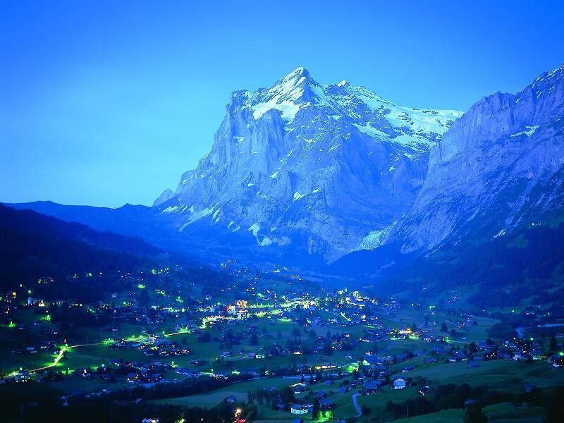 village at base of alpine mountain