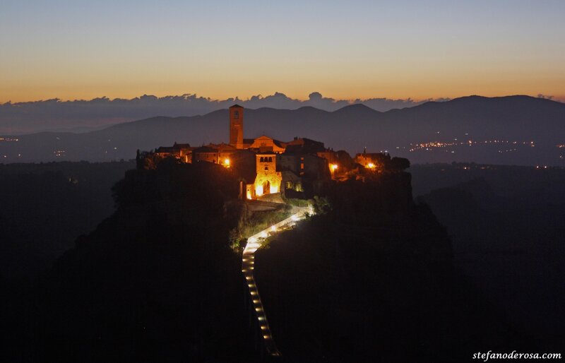 village at dusk on a hill