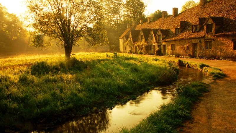 village at sunrise by the river