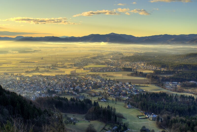 Village at sunrise with fog