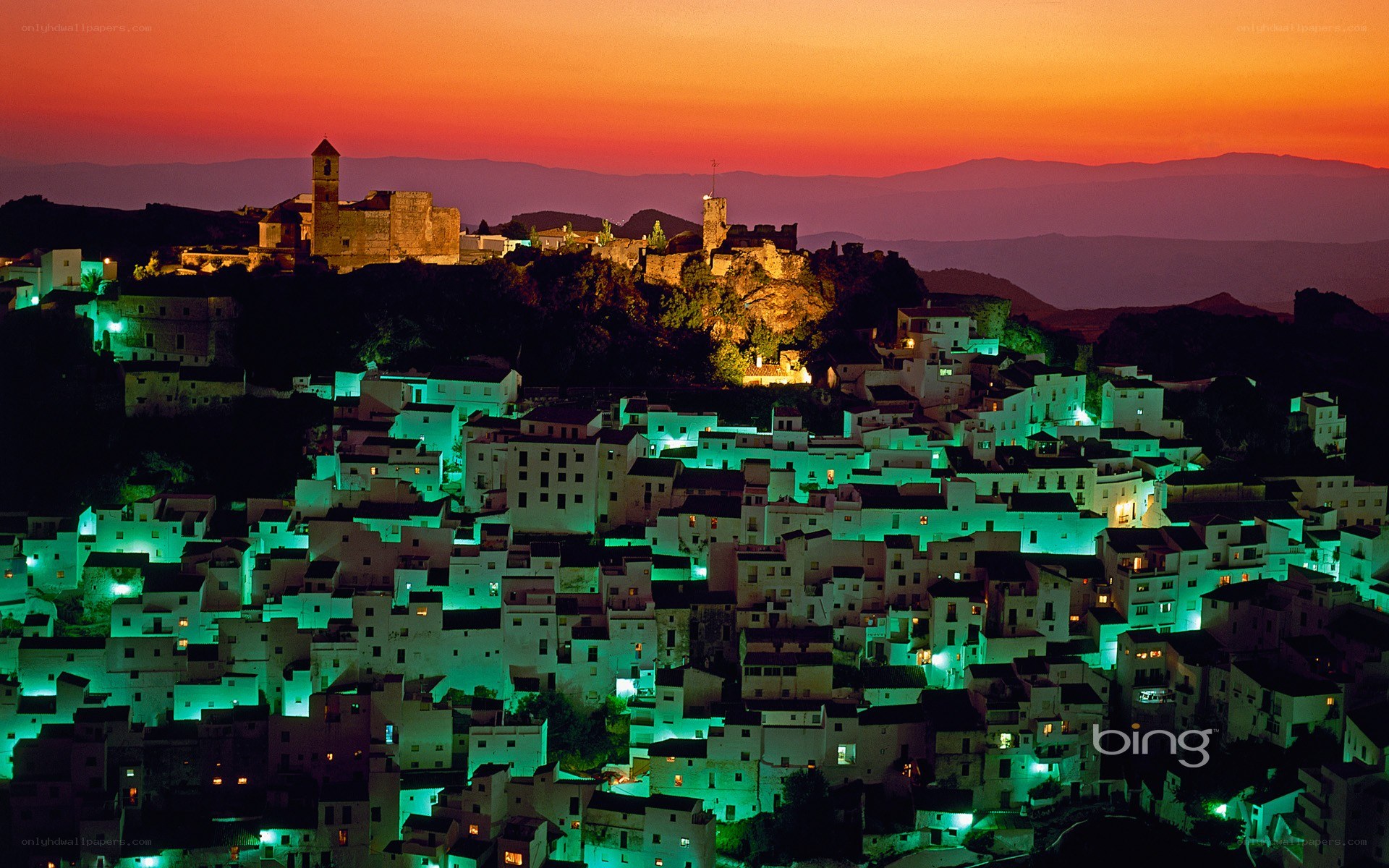 village at sunset with castle