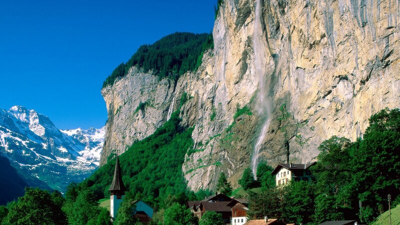 village beneath a waterfall
