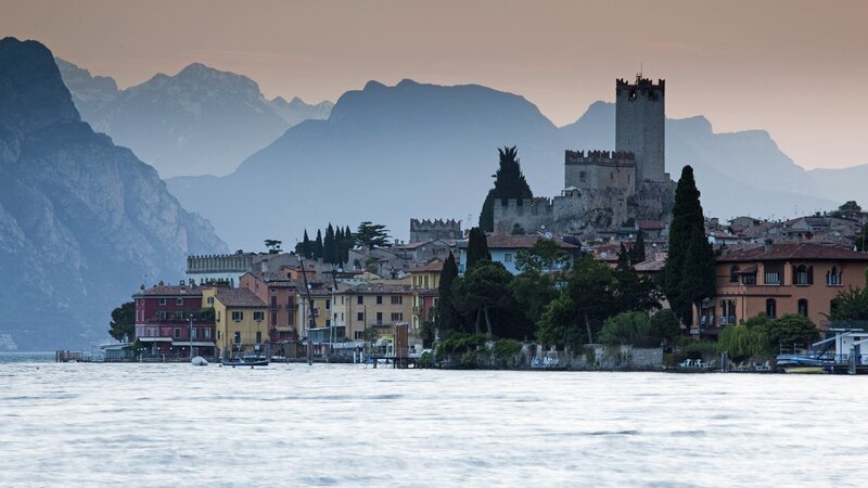 Village by a lake with mountains