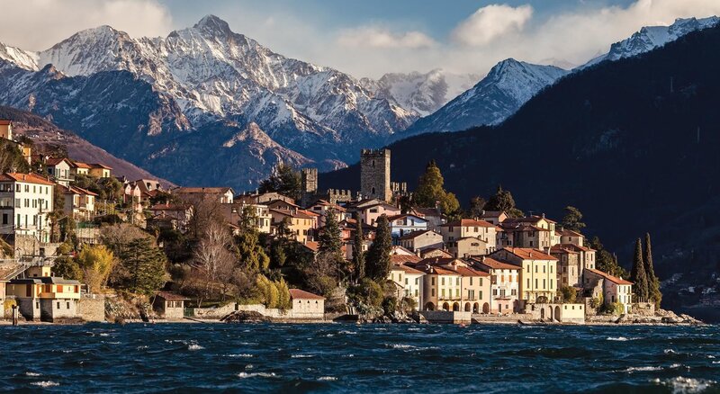 Village by a lake with mountains