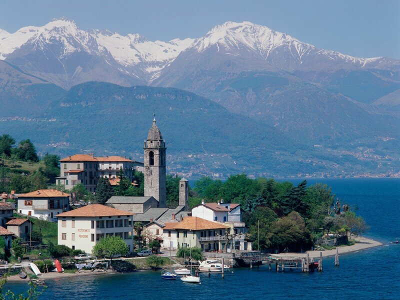Village by a lake with mountains