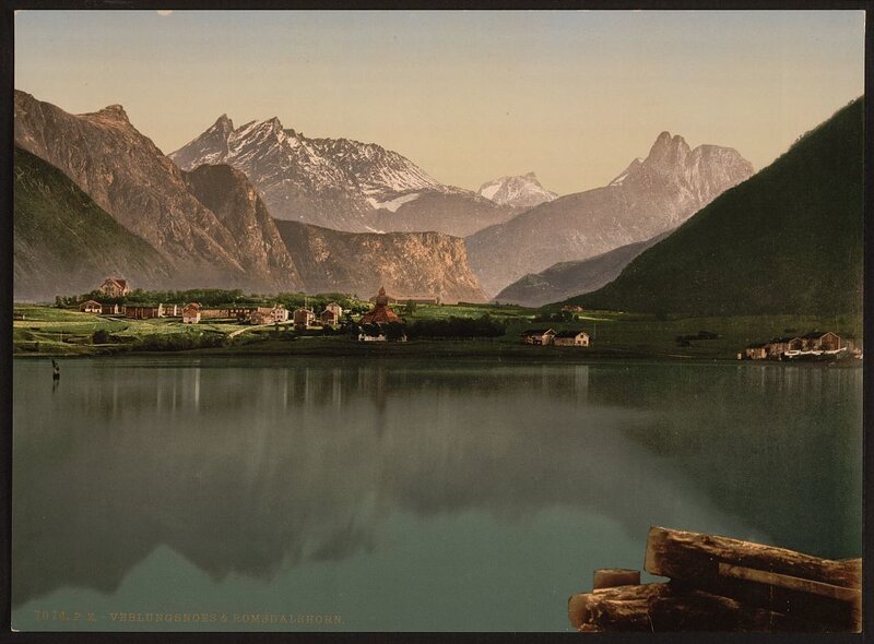 Village by a lake with mountains