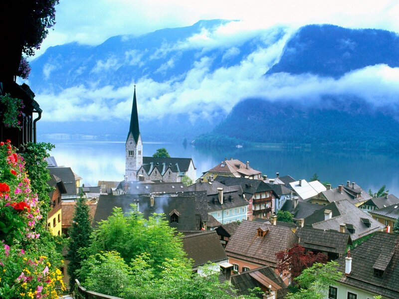 Village by a lake with mountains