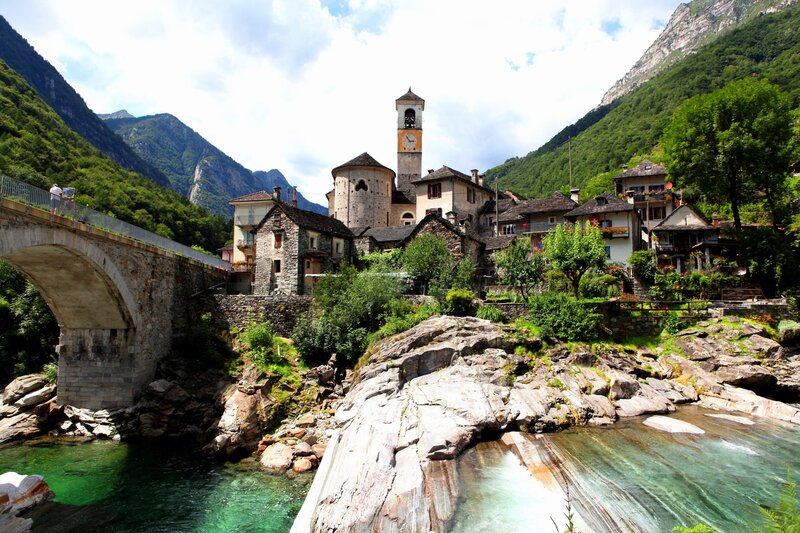 Village by a river in the Alps