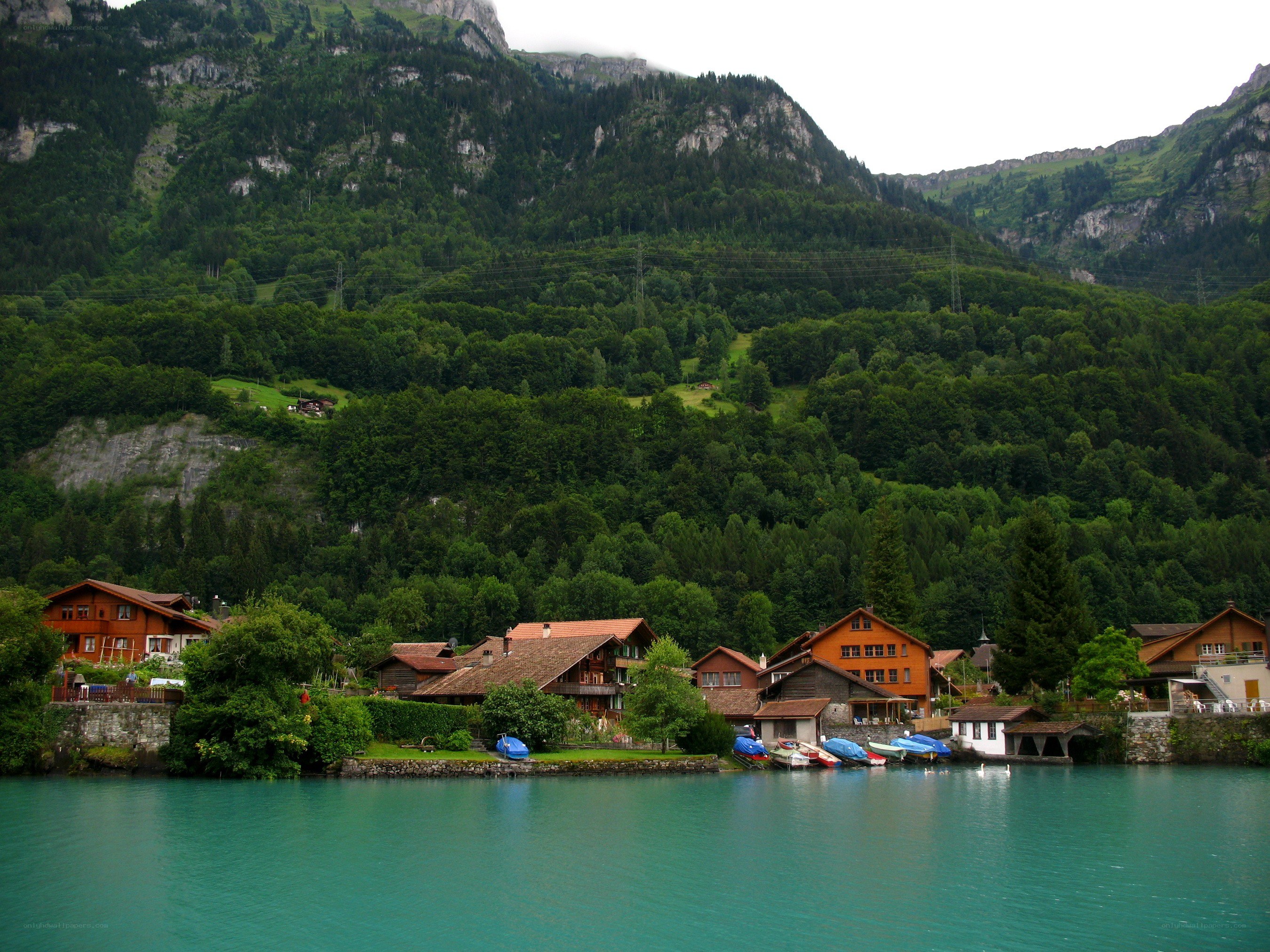 village by a turquoise lake
