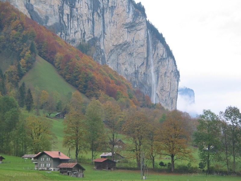 Village by a waterfall cliff