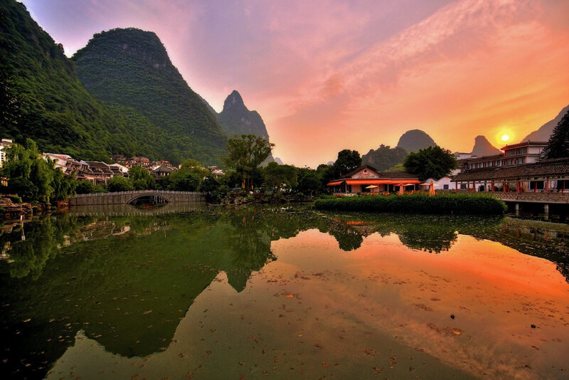 Village by Lake at Sunset — Orange, Serene, Photograph, Mountains