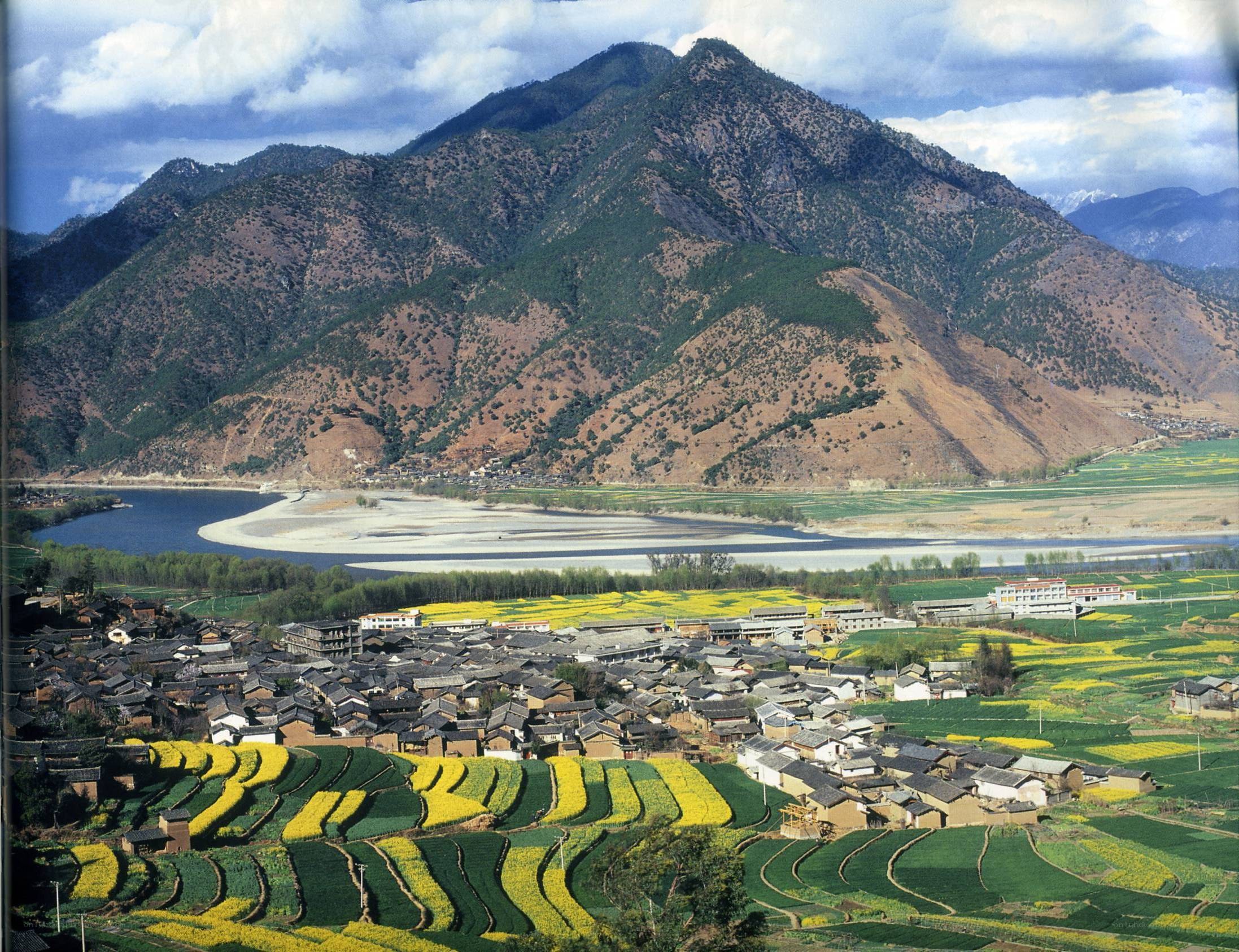 village by river and mountains