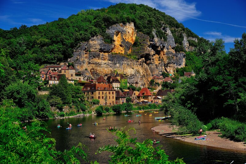 Village by the river and cliff