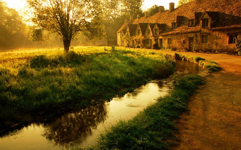 village by the river at sunrise